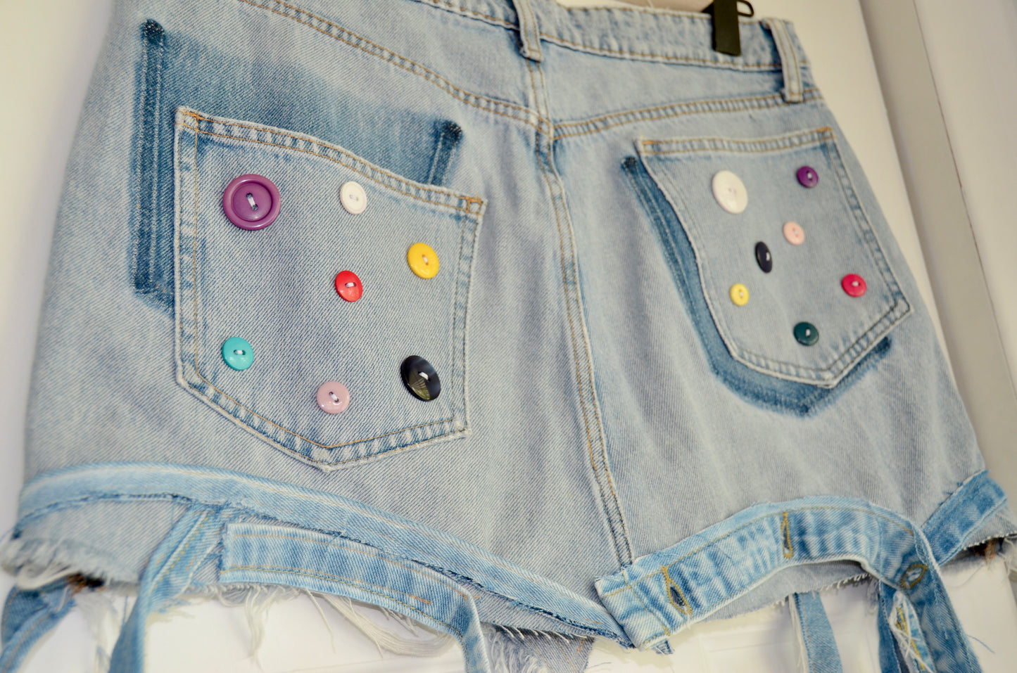 Jeans skirt with colorful buttons 